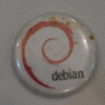 White lapel badge displaying the Debian logo